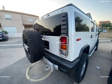 A vendre super Hummer H2 couleur blanche perle A vendre super Hummer H2 couleur blanche perle